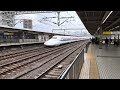 shinkansen bullet train shooting past a railway station in japan. 🇯🇵