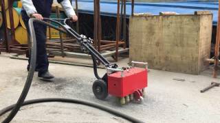 Multi-headed floor scabbler working video