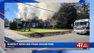 Armed man rescued from burning home in Macon