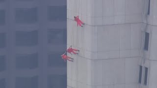 Raw: Chopper video of aerial dance troupe performing on exterior of Transamerica Pyramid