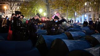 Police forcefully remove migrants from central Paris square in 'shocking' scene