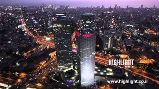 AT 016E Aerial footage Israel: Aerial Tel Aviv - circling Azrieli Towers and cityscape at sunset