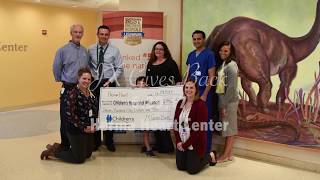 5-year-old JJ presents his doctors at the Herma Heart Center with donation check from JX Gives Back