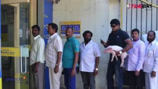 Telugu actor Ravi Babu spotted with piglet at an ATM in Hyderabad | Filmibeat Telugu