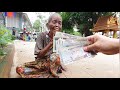 khmer americans give money to poor 83 year old grandma phi chhuon begging on street in siem reap