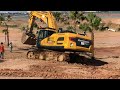 the big machine excavator matador shantui me550lc pro_ working lift biggest rock on construction.