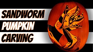 Carving Beetlejuice’s Sandworm Into a Pumpkin.