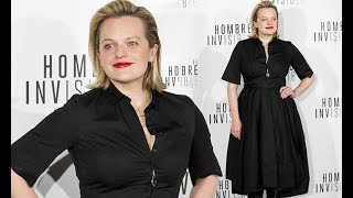 Elisabeth Moss looks effortlessly chic in a black shirt midi dress as she joins her co-stars at The