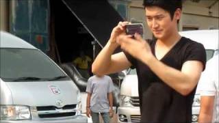 120215 Siwon CF 12 Plus - Taking photo of fans