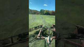 Raking second cutting hay with a John Deere 4250