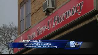 Surveillance video shows violent pharmacy robbery