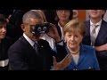 Obama, Merkel try 'virtual reality' glasses