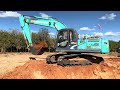 kobelco sk200 8xm excavator loading truck