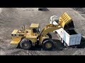 caterpillar 990 wheel loader loading lorries with three passes s.g.m melidis