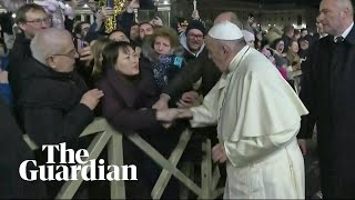 Indignant Pope Francis slaps woman's hand to free himself at New Year's Eve gath