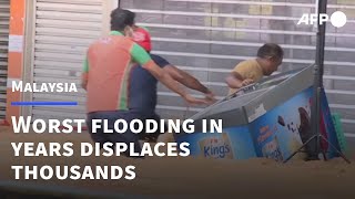 Malaysian urban areas submerged after major flooding | AFP