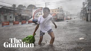 Typhoon Kammuri slams into Philippines forcing hundreds of thousands to flee