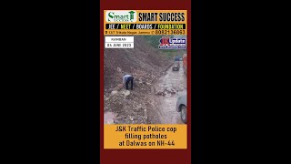 J\u0026K Traffic Police cop  filling potholes at Dalwas on NH-44.