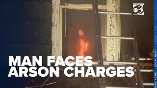 Documents reveal man charged with arson called to report fire, appeared on video