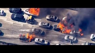 Vehicles ablaze after wildfire sweeps freeway in California