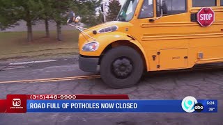 Pothole-laden road is closed in Syracuse