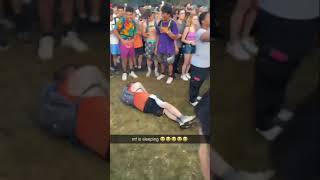 Guy lies down during Coi leray’s performance