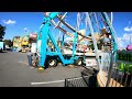 ferris wheel setup pulling rides on the lot