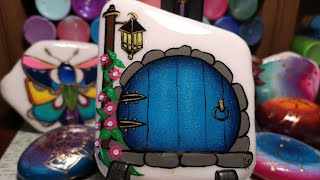 Painted fairy door on Santorini stone