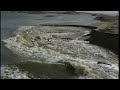 surfers dig deep beach trench how a river wave forms