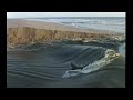 surfers dig deep beach trench how a river wave forms