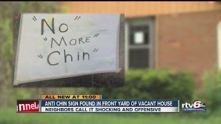 Anti-Chin sign found in front yard of vacant house