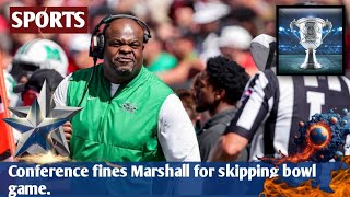 Conference fines Marshall for skipping bowl game.