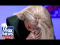 Erika Kirk watches emotional video of her late husband
