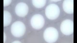 Rotating Bichromal Janus Particles - Reflective Display E-paper Technology from Cospheric LLC