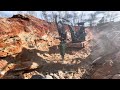 deere 50g mini excavator hammering rock