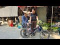 Received a surprise gift: Minh was very happy when the beautiful shop owner gave him a bicycle.