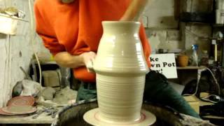 Throwing a big 10 pound clay pottery vase on the wheel