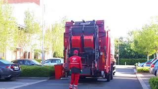 The city bin co bin truck collecting black bins