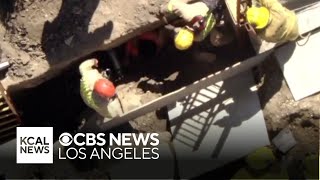 Firefighters rescue a construction trapped inside 8-foot trench for six hours