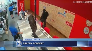 Caught on camera: Armed robber hits Domino's Pizza as brazen crimes on the rise