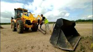 Backhoe Loader  6 in 1 with integral forks