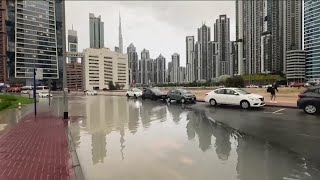 A storm dumps record rain across the desert nation of UAE and floods the Dubai airport