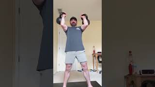 Double 22kg kettlebell clean and press for 7 reps.