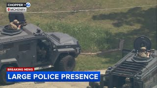 1 taken into custody as military-style armored police vehicles surround McHenry home