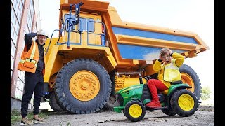 Senya Repairing a broken BIG tractor.