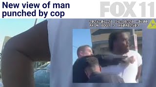 Handcuffed man punched by cop mid-arrest over apparent parking drama