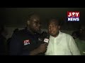 The Foreign Minister is being given a tour to see the living conditions of Ghanaian refugees.