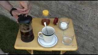 Make Solar Coffee, Cooking with the Sun using a coffee press.