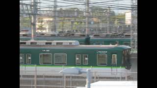 A train passing a train departing from the depot of a Keihan-Densha train. Japanese trains.