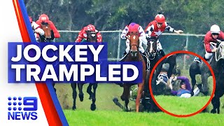 Jockey falls from horse and trampled during race | 9 News Australia